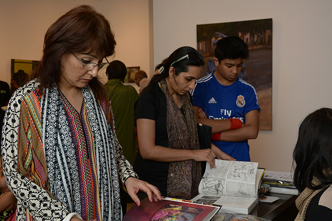 Syeda H. browsing through a copy of Rebel Angel